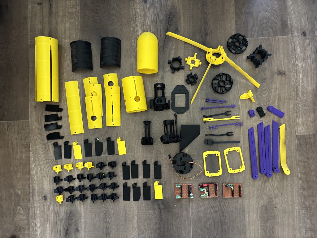 用于原型火箭系统的3D打印结构部件和电子元件。图片由Alisher Khojayev提供