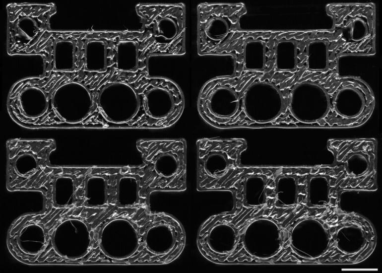 四个3D打印部件分别由四台不同的打印机制作而成。深度学习模型可以识别每个部件的来源打印机